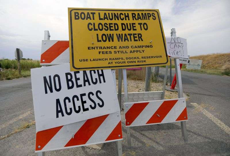 Signs warn boaters of low water at the Willard Bay
South Marina in Willard, Box Elder County, on Monday, July 19,
2021.