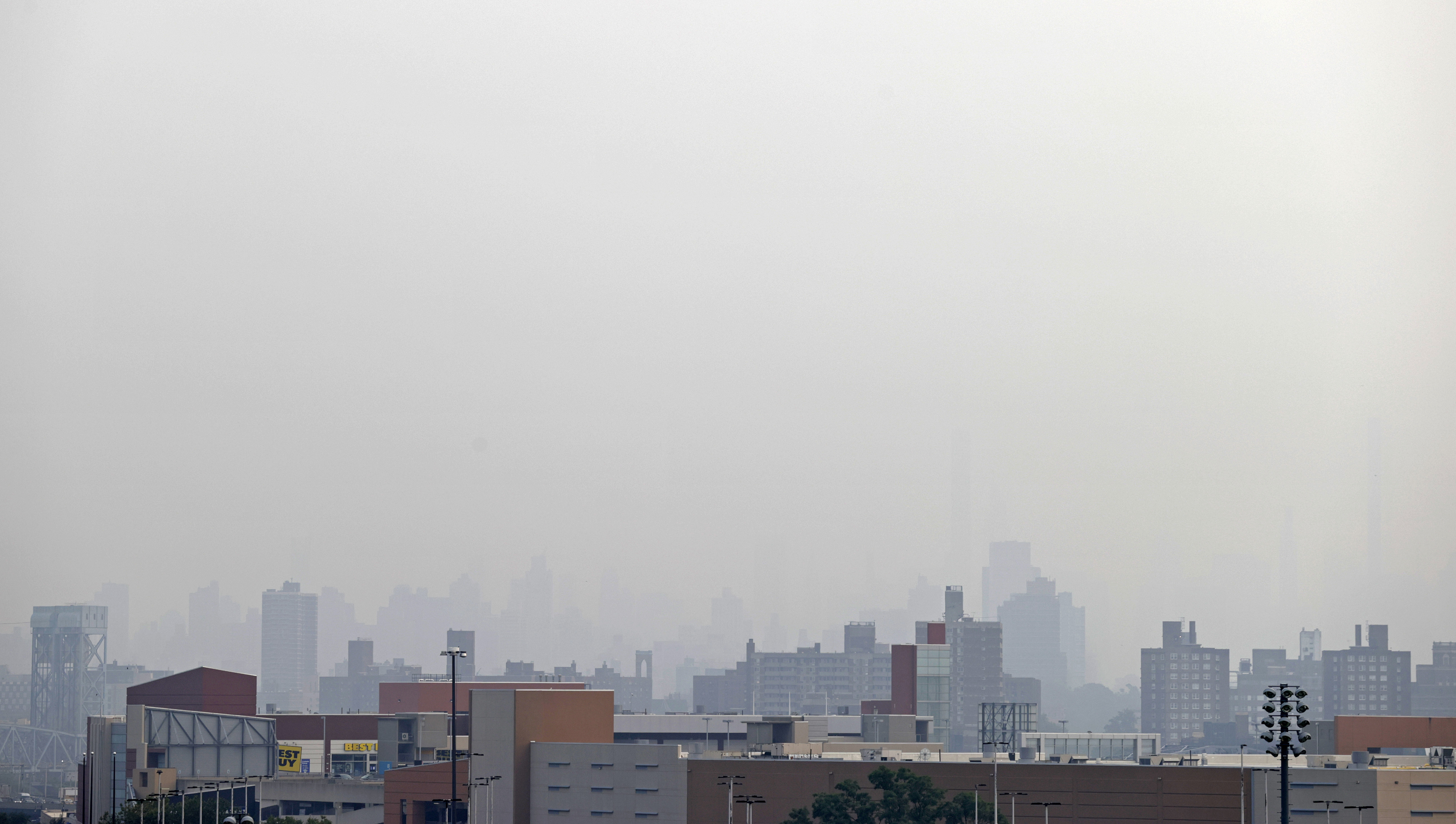 Smoke blocks the view looking toward Manhattan from Yankee Stadium before the Philadelphia Phillies played the New York Yankees in a baseball game Tuesday, July 20, 2021, in New York. 