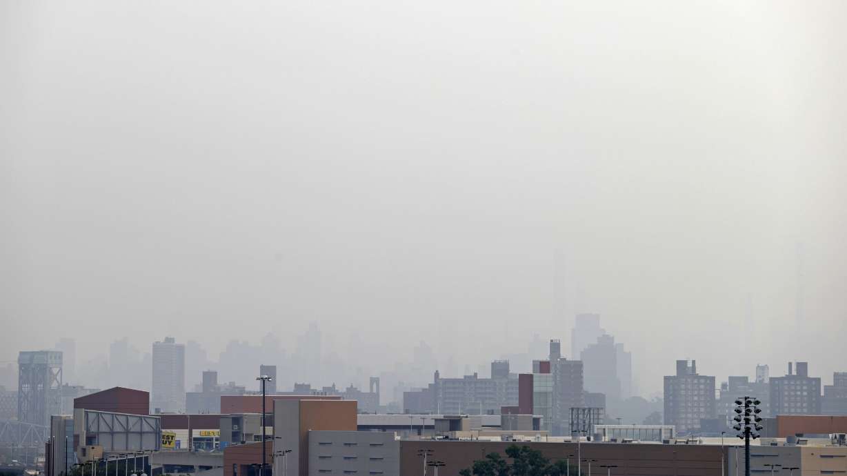Smoke blocks the view looking toward Manhattan from Yankee Stadium before the Philadelphia Phillies played the New York Yankees in a baseball game Tuesday, July 20, 2021, in New York.