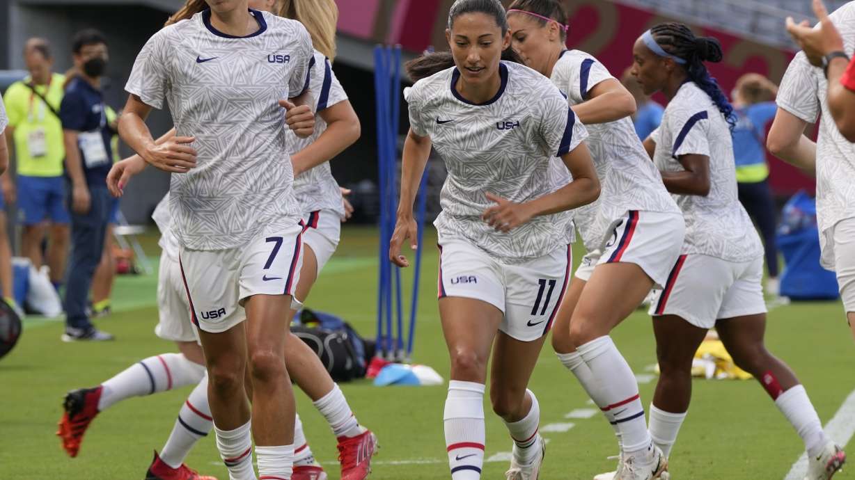 United States players warm up before a women's soccer match against Sweden at the 2020 Summer Olympics, Wednesday, July 21, 2021, in Tokyo.