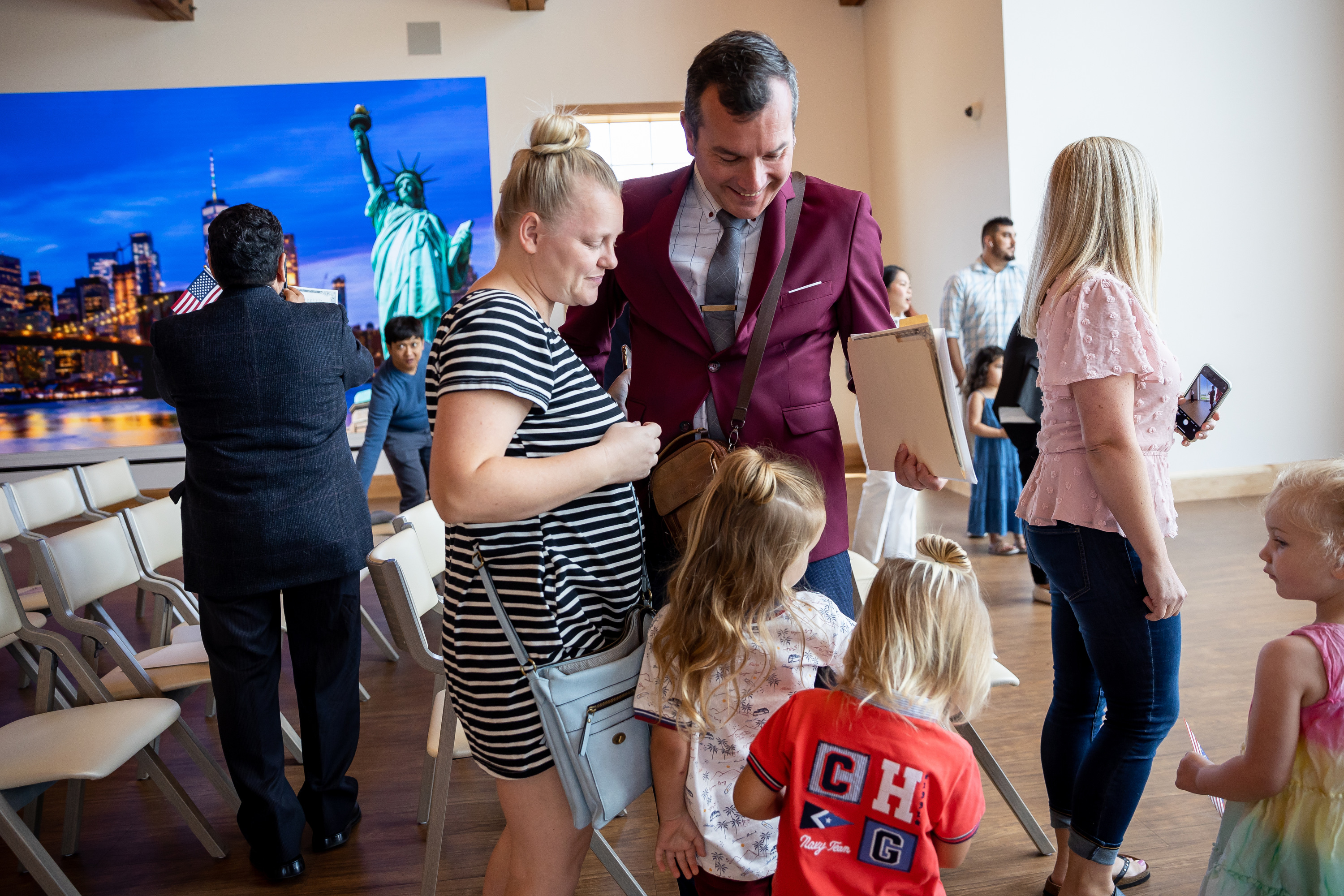 Fermin Soriano Bautista, formerly of Spain, celebrates with his wife, Brittany, and their two daughters, after he became a U.S. citizen at a naturalization ceremony at This is the Place Heritage Park in Salt Lake City on Wednesday, July 21, 2021.