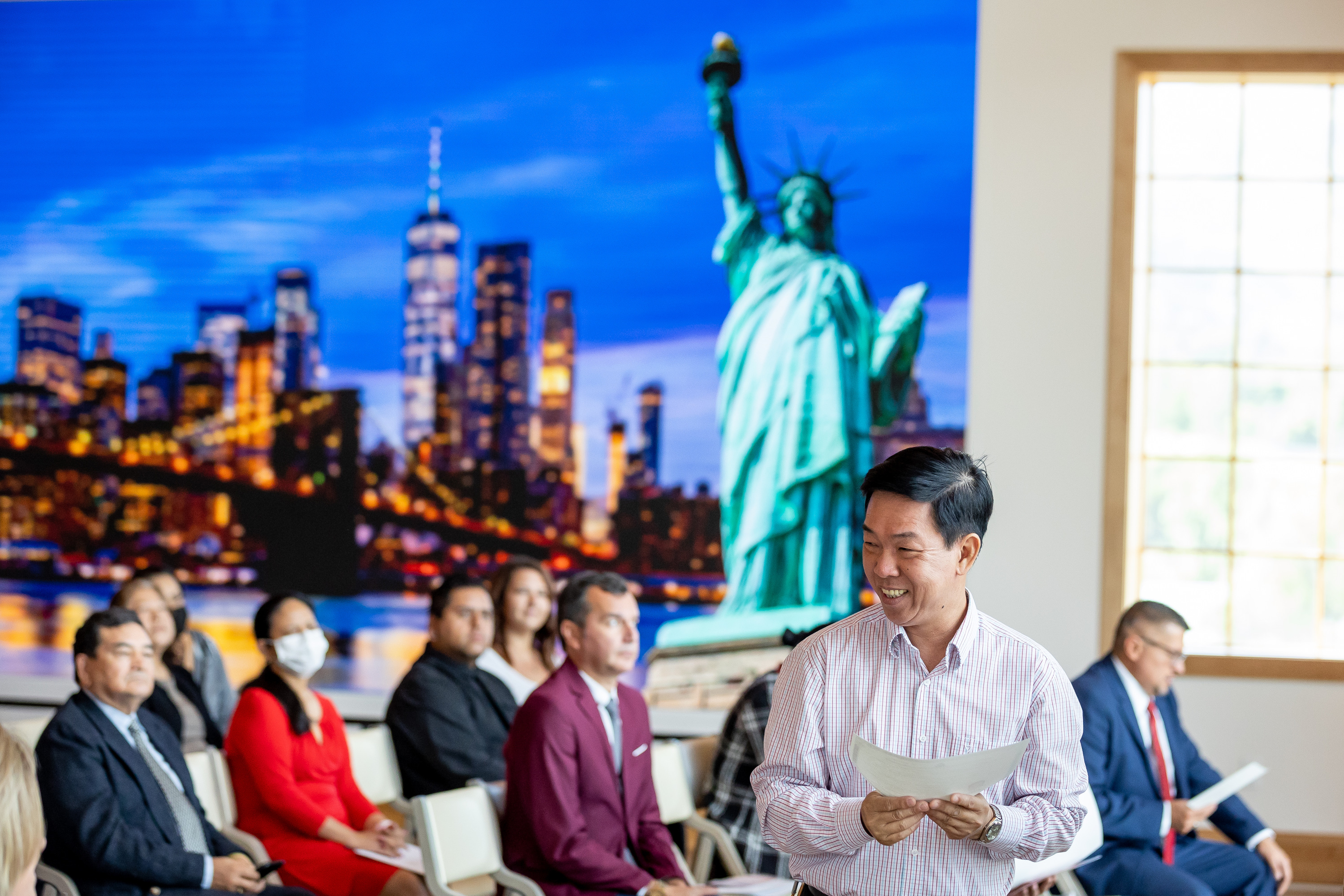 Tuan Do, formerly of Vietnam, smiles as he receives his U.S. citizenship certificate at a naturalization ceremony at This is the Place Heritage Park in Salt Lake City on July 21, 2021. A new report showing the influence immigrants have had on Utah's economy is more than enough reason for a local task force to ensure those coming to the state continue to have good experiences here.