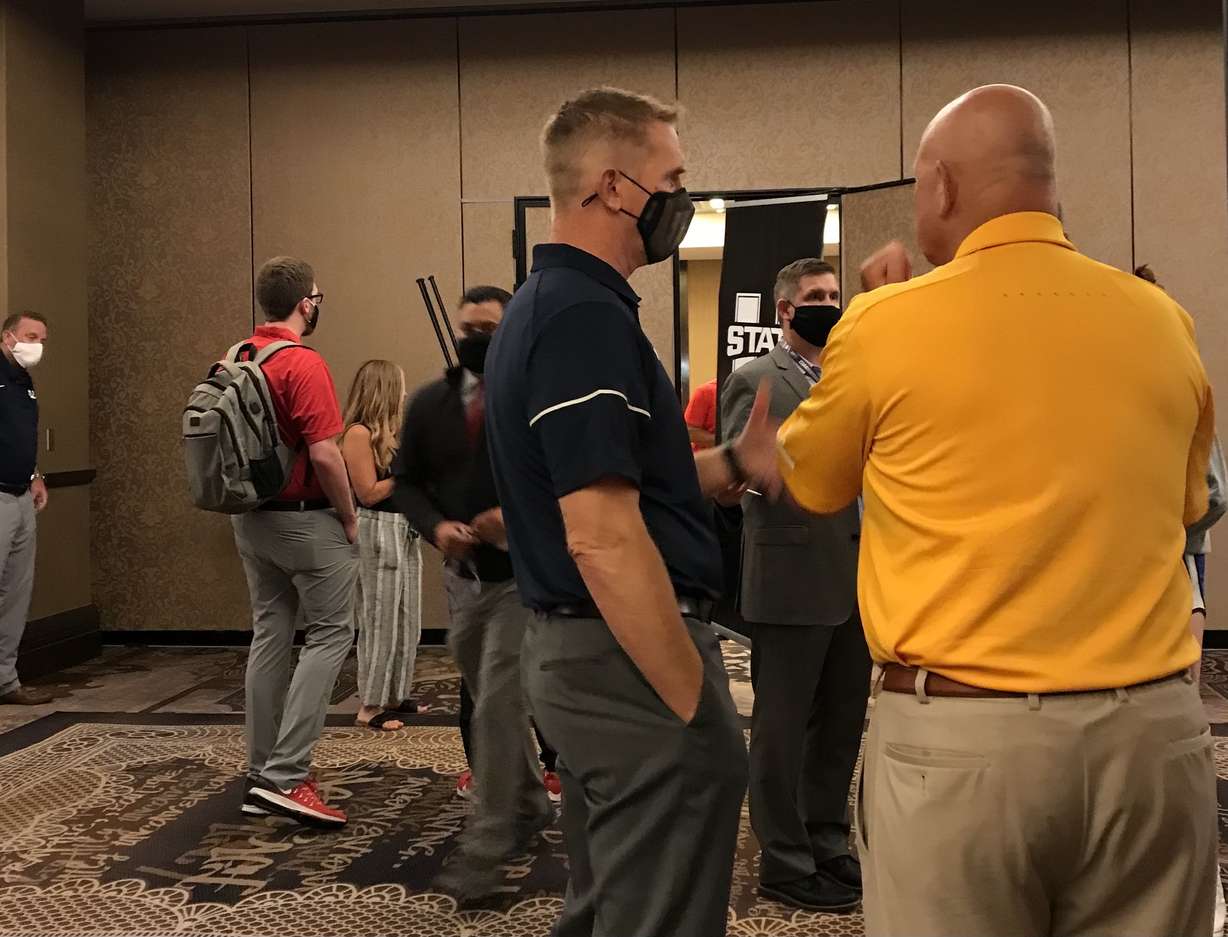 Utah State coach Blake Anderson with Wyoming coach Craig Bohl during Mountain West media days, Wednesday, July 21, 2021 in Las Vegas.