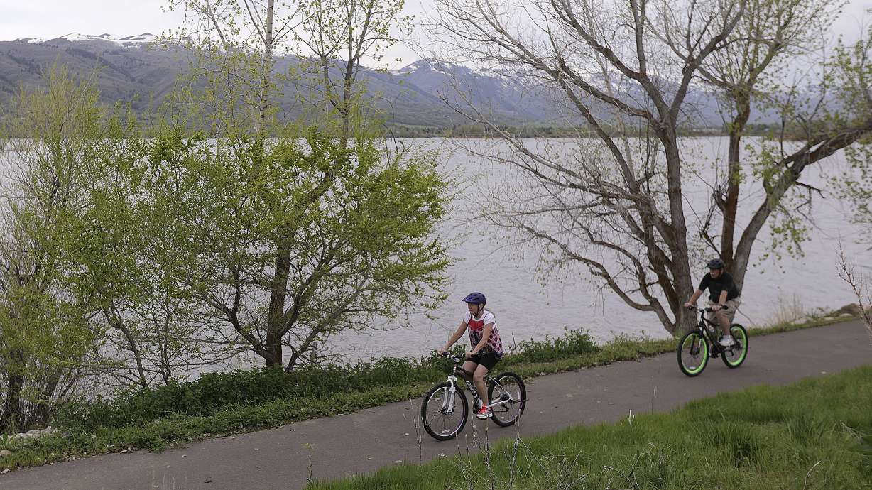 Debbie St. James and Mike St. James bike on a bike path along the Pineview Reservoir near Huntsville, Weber County, on Wednesday, May 15, 2019. Utah Department of Transportation officials on Wednesday opened up public comment to better understand the demand of bike lanes and multiuse paths in the state.
