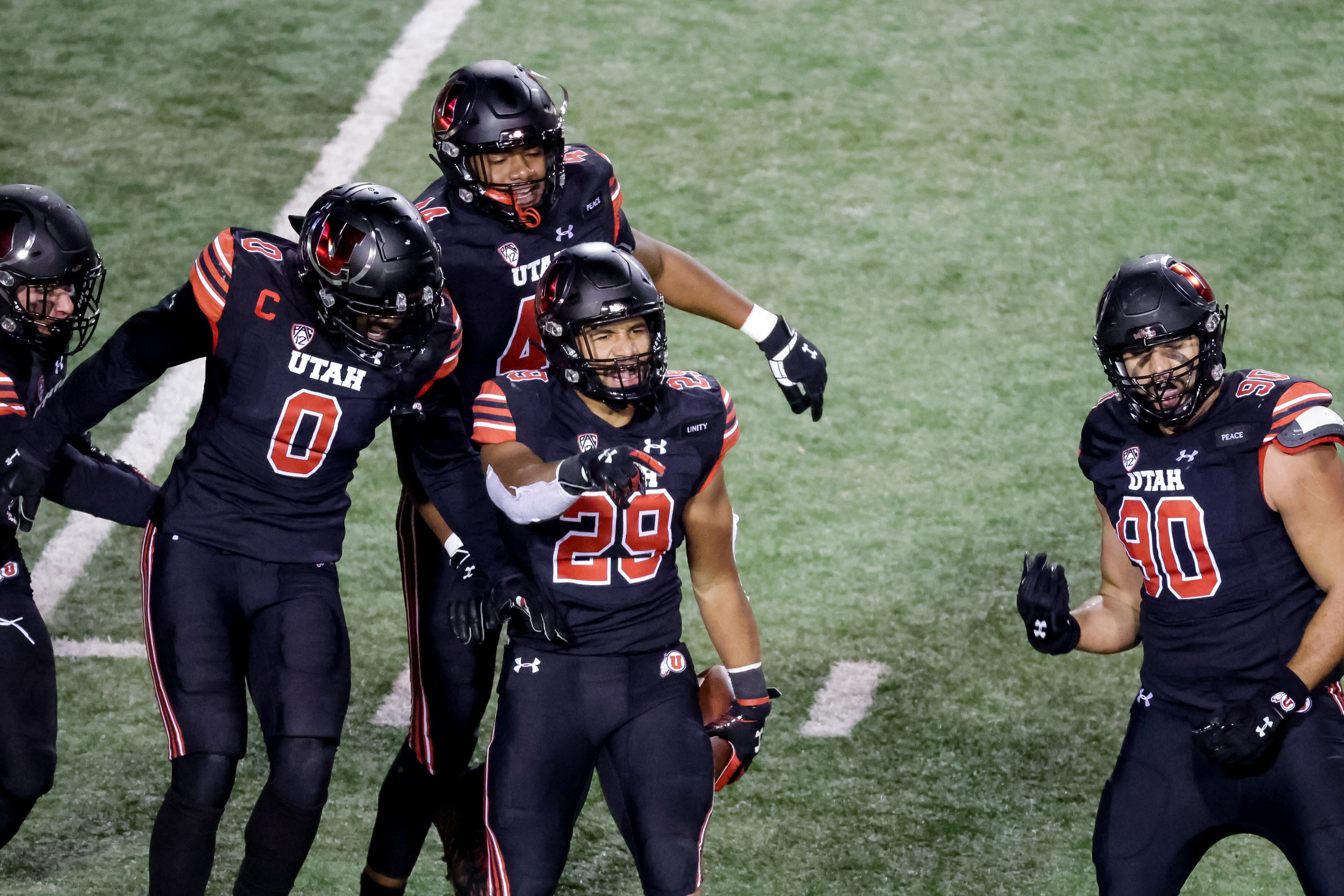 Utah Utes linebacker Nephi Sewell (29) celebrates with teammates after he intercepted a pass during the game against the USC Trojans at Rice-Eccles Stadium in Salt Lake City on Saturday, Nov. 21, 2020.