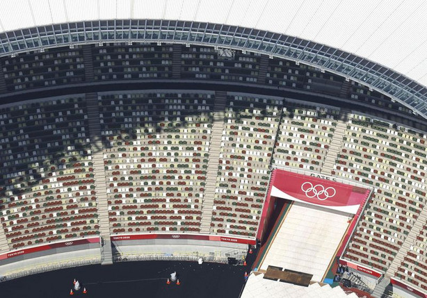 In this aerial photo, the Olympic rings are seen with
spectators’ seats at the National Stadium in Tokyo.