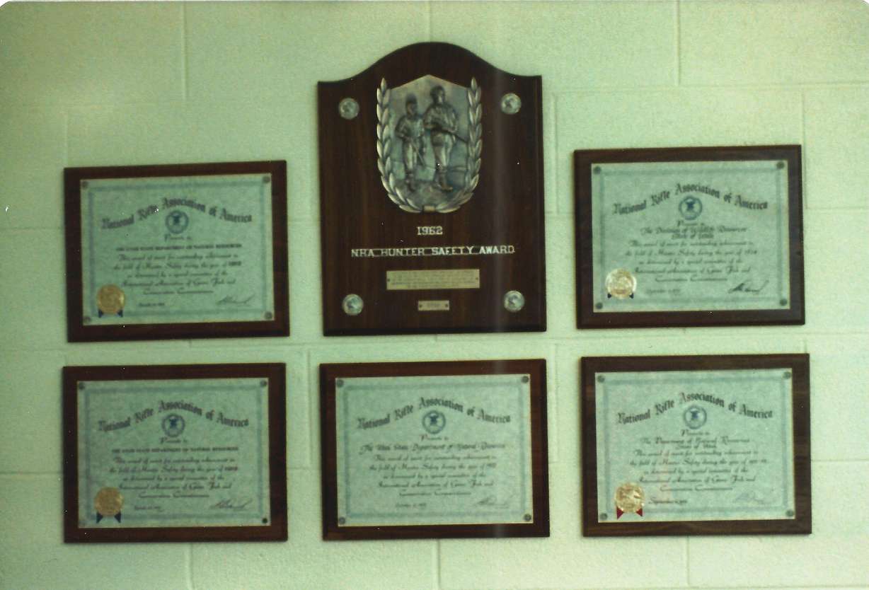 A row of hunter safety plaques given to Utah at the time the Lee Kay Public Shooting Range opened in September 1981. Utah began to receive safety awards in the 1960s as its number of hunting incidents and deaths fell and hunting education grew.