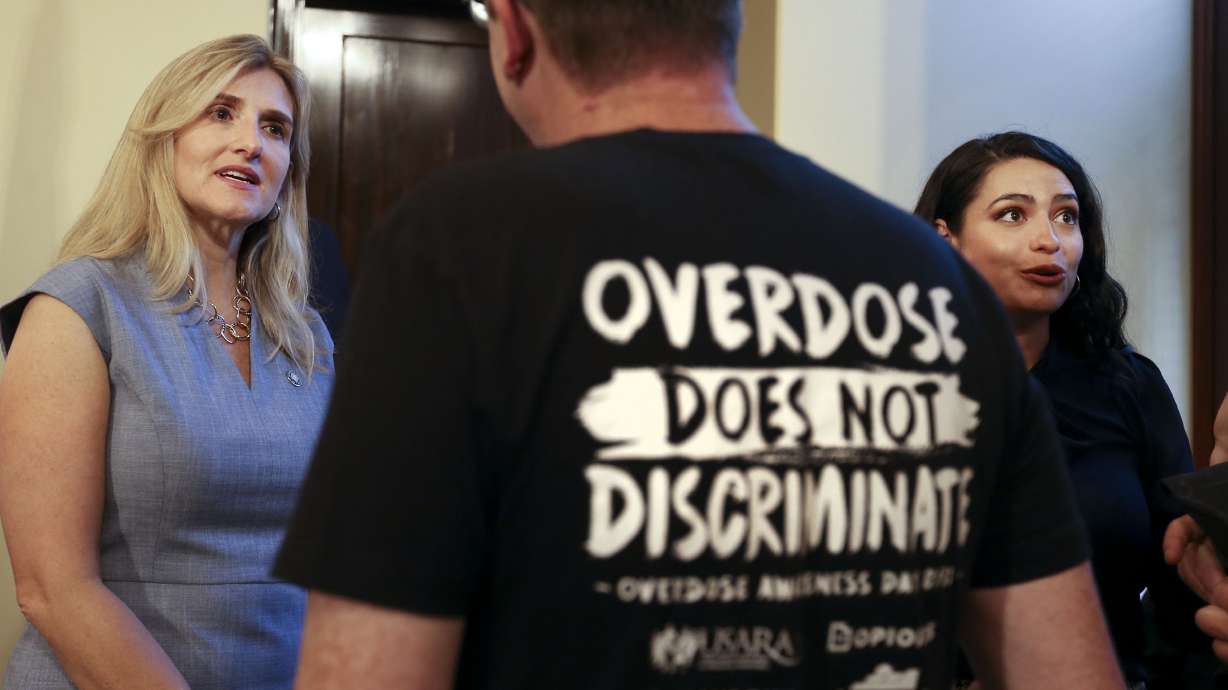 Margaret Busse of the Utah Department of Commerce speaks with Evan Done of Utah Support Advocates for Recovery Awareness, on July 22, 2021. The Utah Opioid Task Force expressed concerns Tuesday about increased opioid deaths statewide and the recent appearance of mixed substances in drugs.