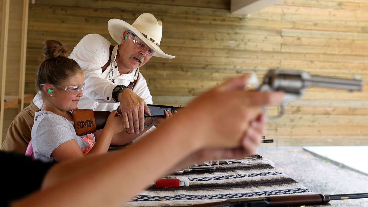 Steve Adamson teaches Emma Timothy of South Jordan how to fire a handgun during the third annual Outdoor Adventure Days at the Lee Kay Public Shooting Range Salt Lake City on Friday, June 10, 2016. The facility was constructed 40 years ago this year as a way to further hunter safety education.
