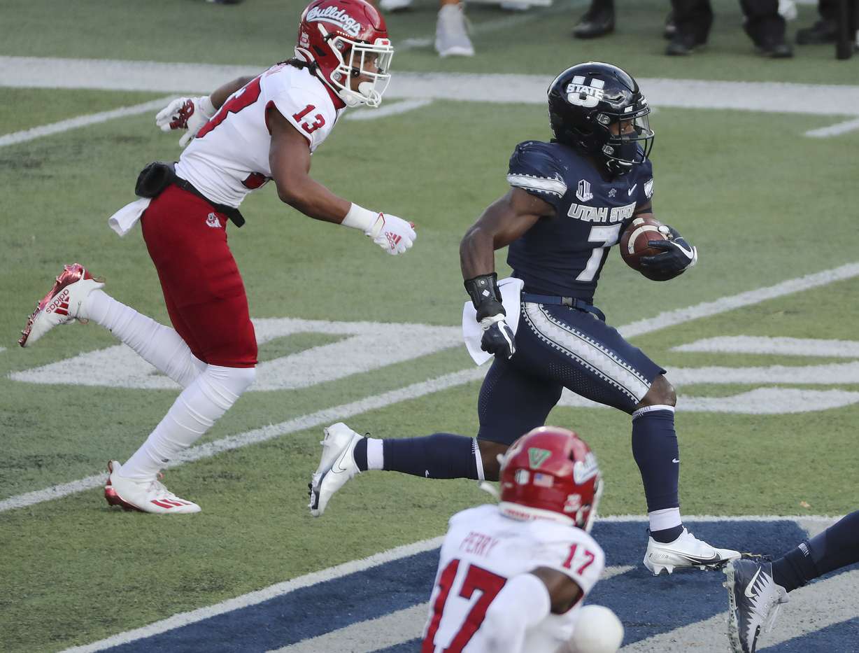Utah State Aggies running back Devonta'e Henry-Cole (7) runs against the Fresno State Bulldogs in Logan on Saturday, Nov. 14, 2020.