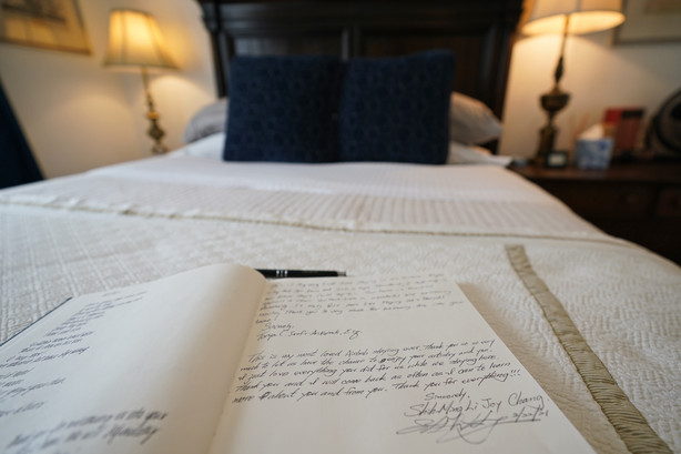 The guest book for the bed-and-breakfast The House of Bise Bespoke rests on a bed, Monday, July 19, 2021, in Cleveland. Small businesses in the U.S. that depend on tourism and vacationers say business is bouncing back, as people re-book postponed trips and take advantage of loosening restrictions, a positive sign for the businesses that have struggled for more than a year. Bise started in 2019 and catered to international tourists, attracting guests from New Zealand, Botswana, Eastern Europe and elsewhere.