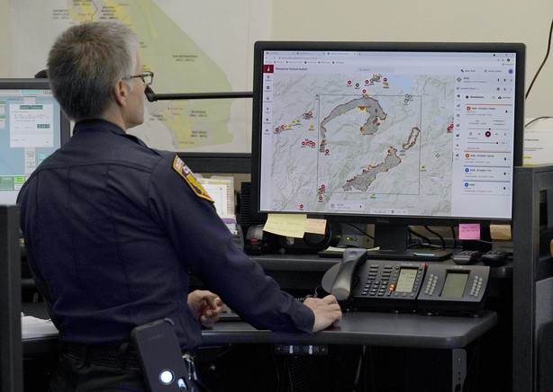 Cal Fire Capt. Danell Eshnaur uses the Fire Response Tactical Analyst program to use computer modeling to help pre-position fire fighting resources on the Dixie Fire at the California Department of Forestry and Fire Protection's Sacramento Command Center in Rancho Cordova, Calif., Friday, July 23, 2021. Firefighters are trying to become smarter in how they prepare for the drought- and wind-driven wildfires that have become more dangerous across the American West in recent years, including by using new technology like fire behavior computer modeling that can help assess risks before fires start, then project their path and growth.