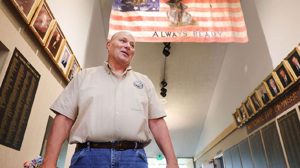 Brad Clayton, president of the Sons of Utah Pioneers,
talks about a flag carried by the Mormon Battalion that is on
display at the organization’s office in Millcreek on Wednesday,
July 14, 2021.