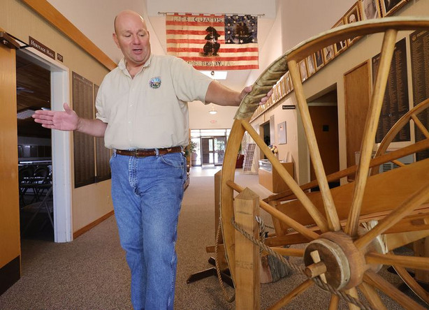 Brad Clayton, president of the Sons of Utah Pioneers,
talks about a replica handcart on display at the organization’s
office in Millcreek on Wednesday, July 14, 2021.