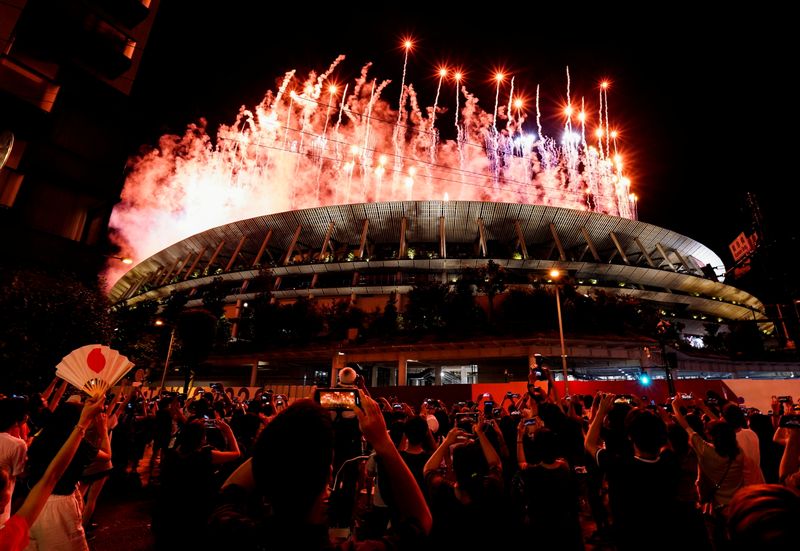 FILE PHOTO: Tokyo 2020 Olympics - The Tokyo 2020 Olympics Opening Ceremony - Olympic Stadium, Tokyo, Japan - July 23, 2021. Fireworks are seen from outside the stadium during the Opening Ceremony.