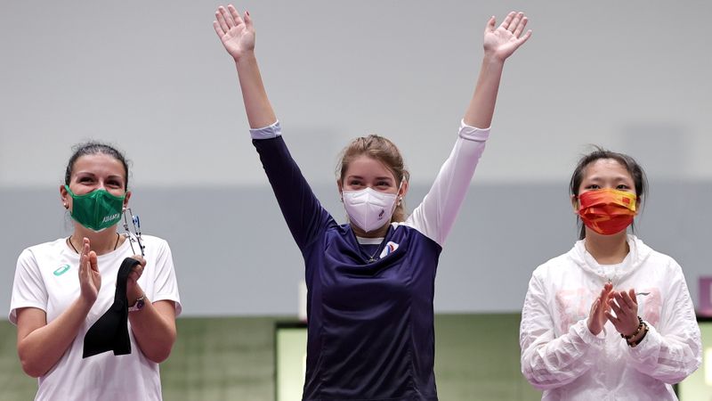 Tokyo 2020 Olympics - Shooting - Women's 10m Air Pistol - Final - Asaka Shooting Range, Tokyo, Japan - July 25, 2021. Gold medallist Vitalina Batsarashkina of the Russian Olympic Committee celebrates with silver medallist, Antoaneta Boneva of Bulgaria and bronze medallist, Jiang Ranxin of China.