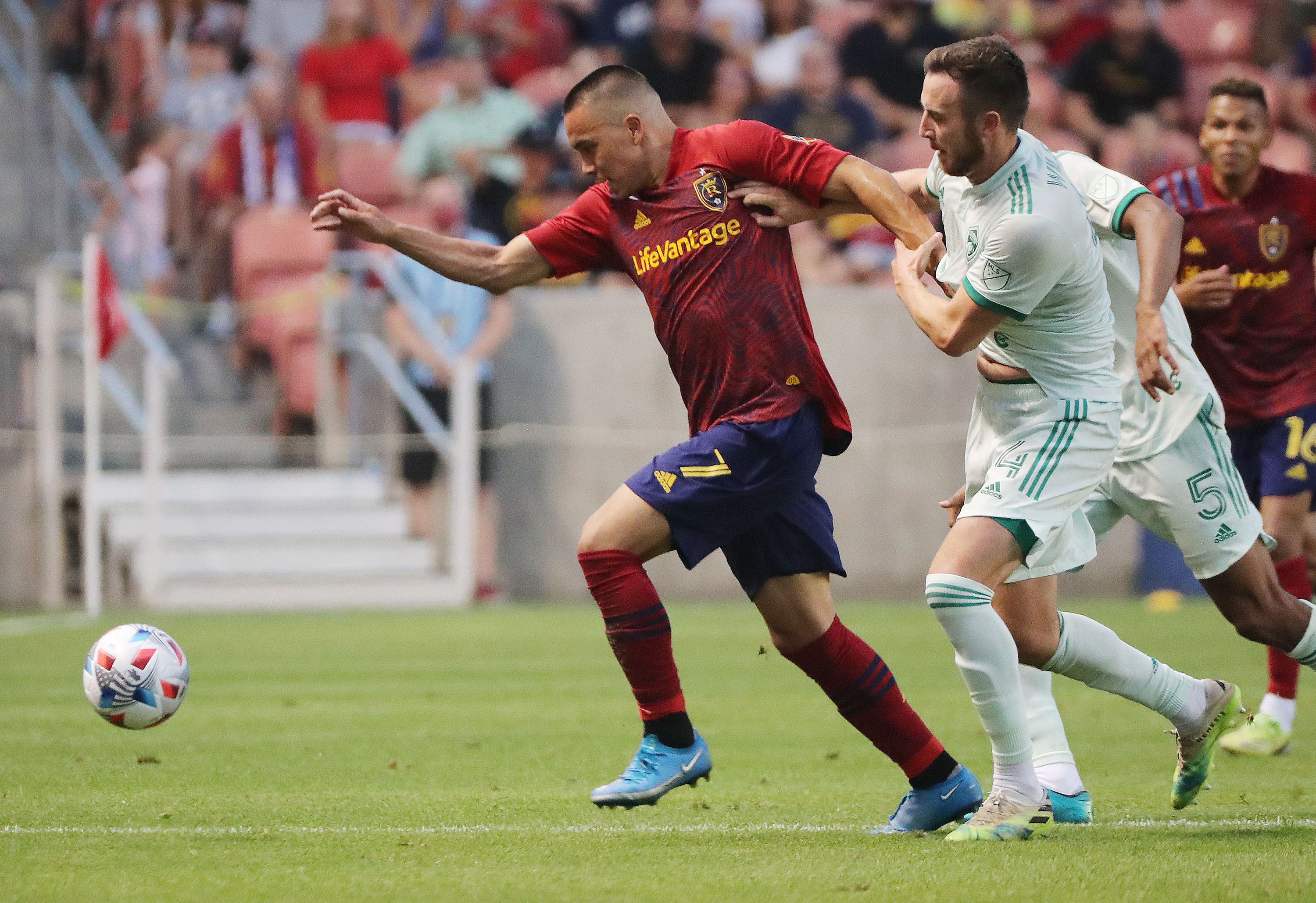 Real Salt Lake forward Bobby Wood (7) and Colorado Rapids defender Danny Wilson (4) compete for the ball at Rio Tinto Stadium in Sandy on Saturday, July 24, 2021. RSL won, 3-0.