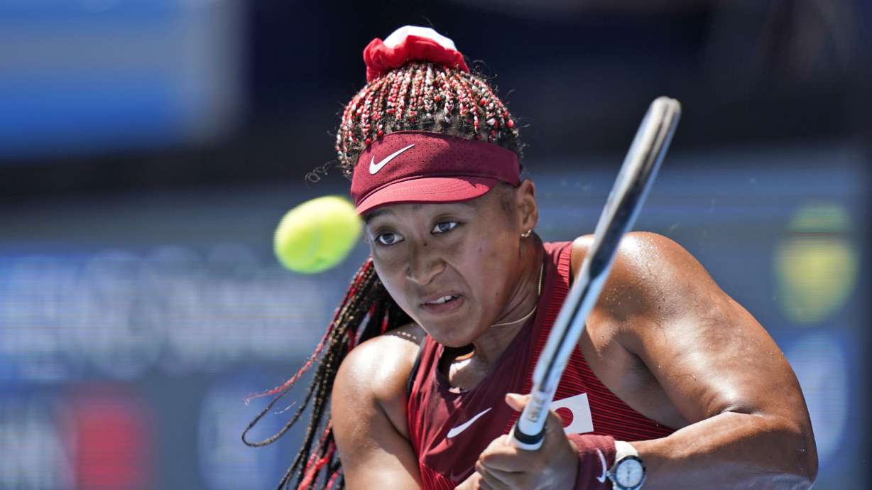Naomi Osaka, of Japan, plays against Saisai Zheng, of China, during the first round of the tennis competition at the 2020 Summer Olympics, Sunday, July 25, 2021, in Tokyo, Japan.