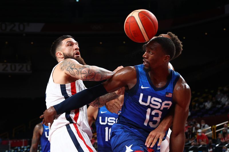 Tokyo 2020 Olympics - Basketball - Men - Group A - France v United States - Saitama Super Arena, Saitama, Japan - July 25, 2021. Edrice Adebayo of the United States in action with Vincent Poirier of France