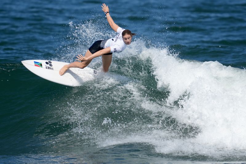 Jul 25, 2021; Tokyo, Japan; Bianca Buitendag (RSA) surfs in the women’s round two competition during the Tokyo 2020 Olympic Summer Games at Tsurigasaki Surfing Beach.