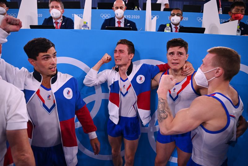 Tokyo 2020 Olympics - Gymnastics - Artistic - Men's Team - Final - Ariake Gymnastics Centre, Tokyo, Japan - July 26, 2021. Artur Dalaloyan of the Russian Olympic Committee, David Belyavskiy of the Russian Olympic Committee, Denis Abliazin of the Russian Olympic Committee and  Nikita Nagornyy of the Russian Olympic Committee celebrate after winning gold