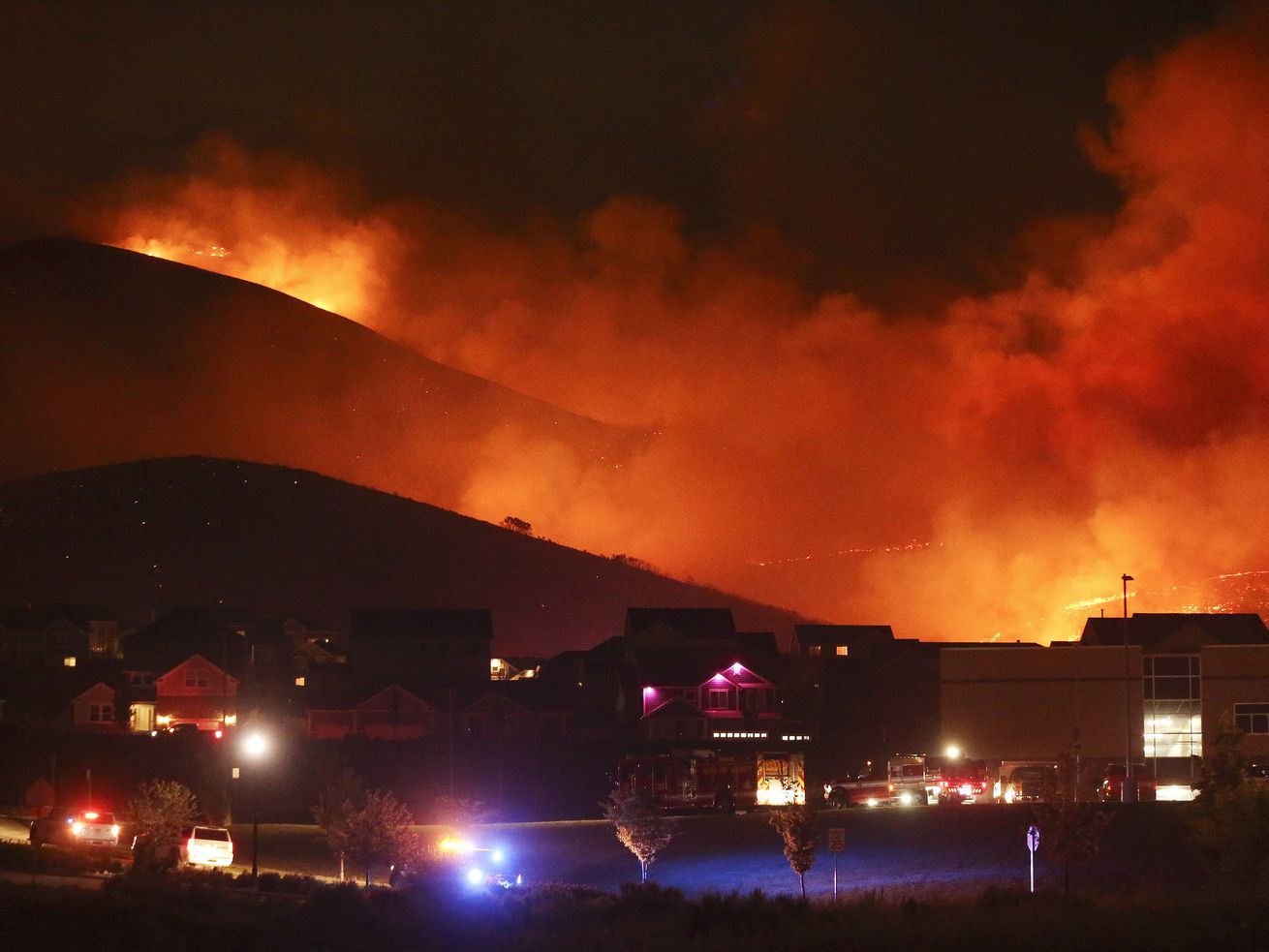A wildfire on Traverse Mountain threatens homes in Lehi on Sunday, June 28, 2020. Utah Rep. Blake Moore’s bipartisan bill
joins several measures lawmakers have proposed to prevent massive
fires.