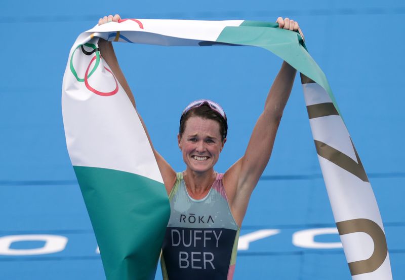 Tokyo 2020 Olympics - Triathlon - Women's Olympic Distance - Final - Odaiba Marine Park, Tokyo, Japan July 27, 2021. Flora Duffy of Bermuda celebrates victory.