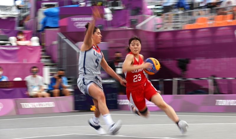 Tokyo 2020 Olympics - Basketball 3x3 - Women - Pool A - United States v Japan - Aomi Urban Sports Park, Tokyo, Japan - July 27, 2021. Mai Yamamoto of Japan in action with Kelsey Plum of the United States during a match.