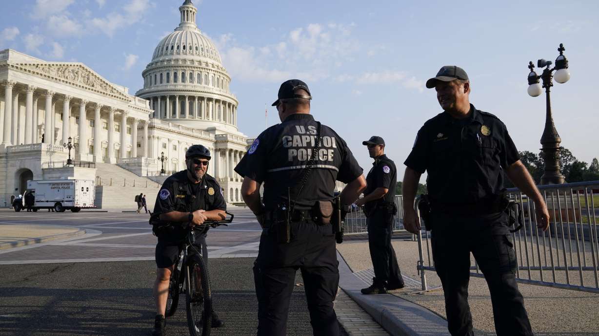 The United States Capitol is seen in Washington, early Tuesday, July 27, 2021, as Capitol police keep eyes on the perimeter.