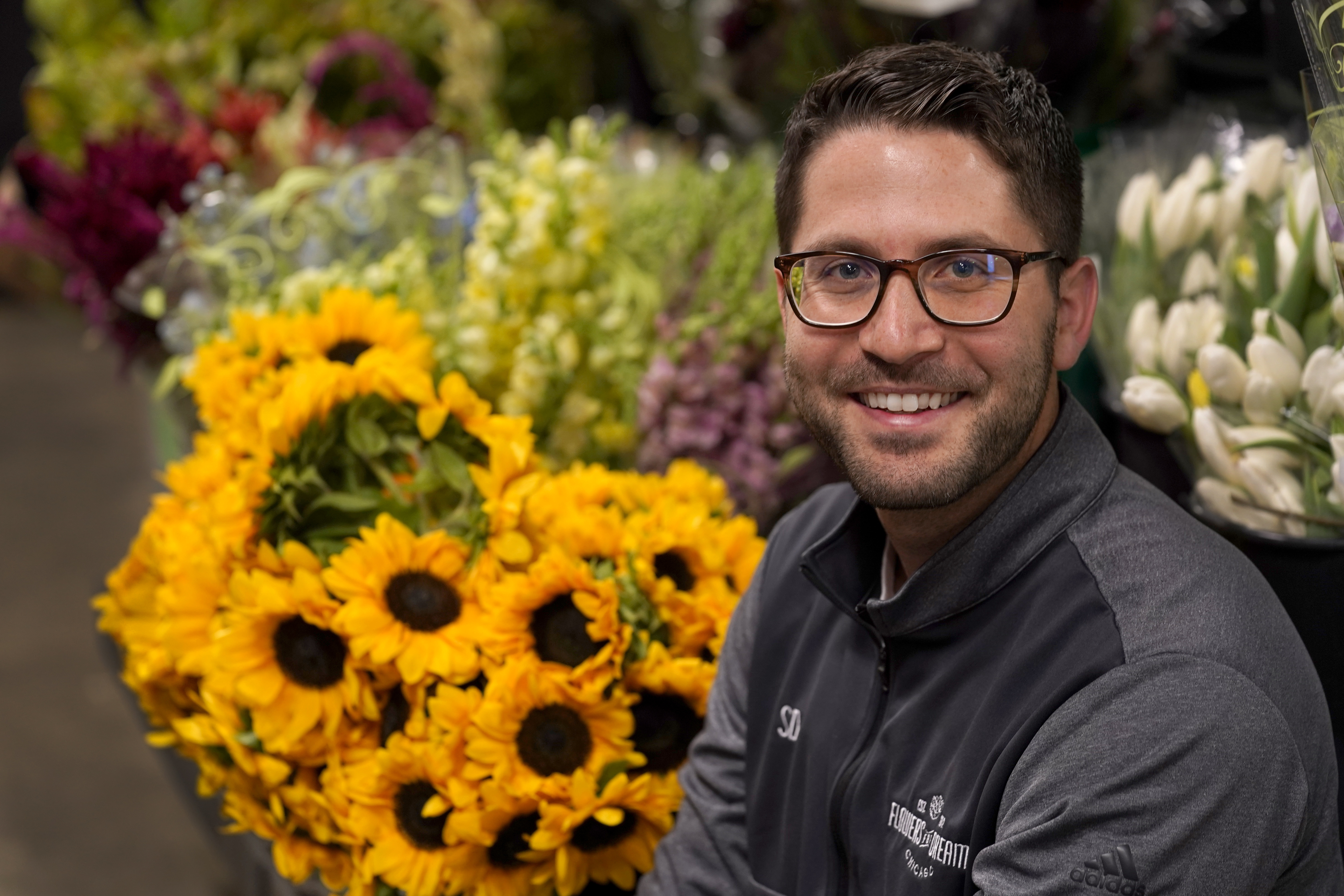 Steven Dyme, owner of Flowers for Dreams, poses for a portrait at his warehouse Friday, July 23, 2021, in Chicago. Dyme says the $15 minimum made it much easier to staff up when the economy reopened this spring and demand for flowers, particularly for weddings, soared.
