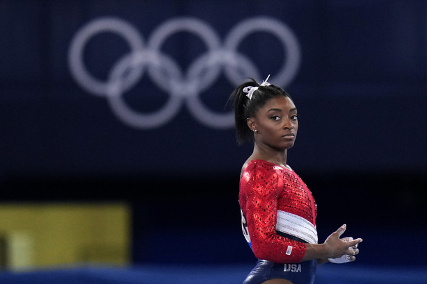 Simone Biles, of the United States, waits to perform on the vault during the artistic gymnastics women's final at the 2020 Summer Olympics, Tuesday, July 27, 2021, in Tokyo. The American gymnastics superstar has withdrawn the all-around competition to focus on her mental well-being.