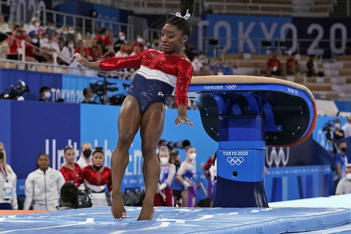 Simone Biles, of the United States, lands from the vault during the artistic gymnastics women's final at the 2020 Summer Olympics, Tuesday, July 27, 2021, in Tokyo.