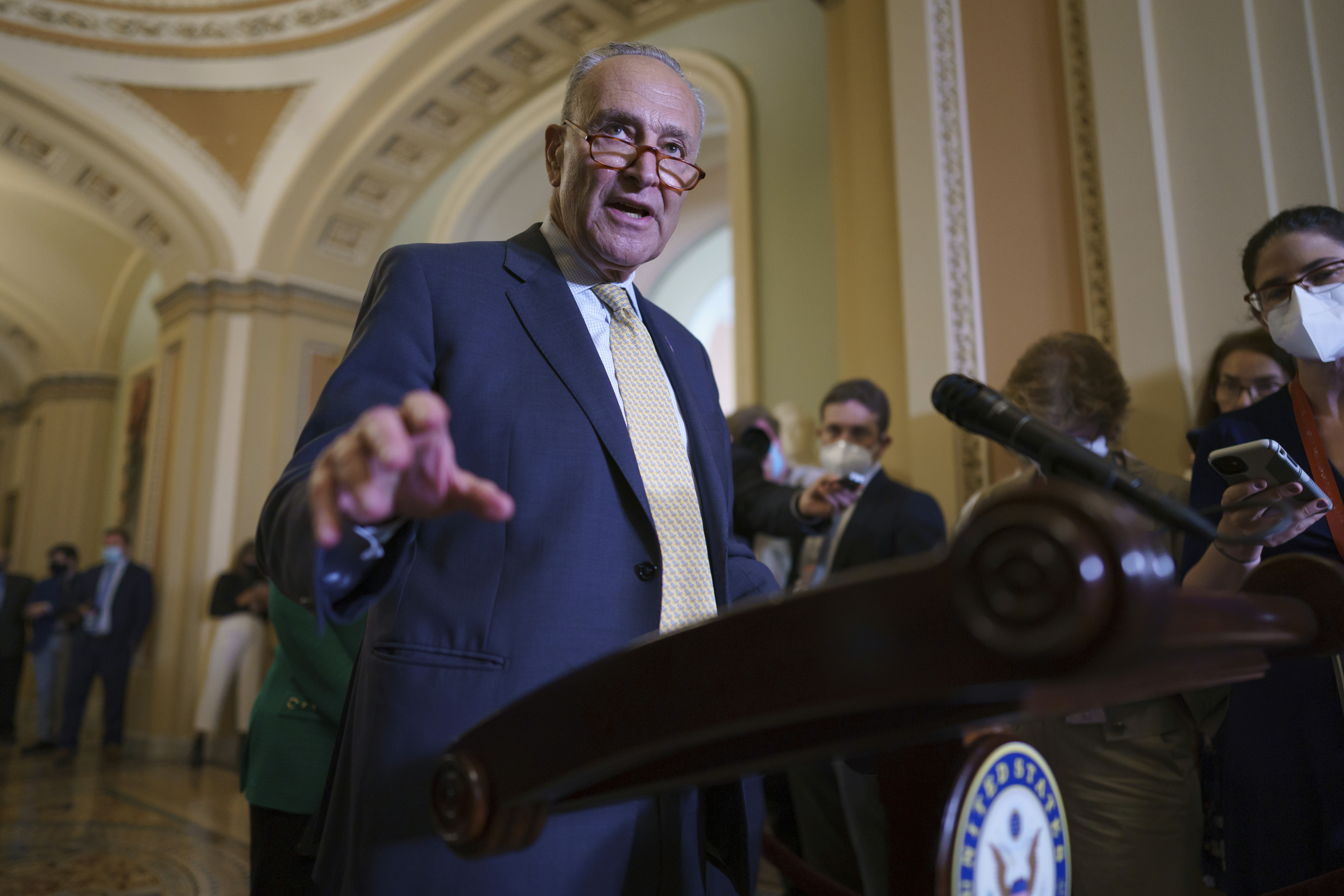 Senate Majority Leader Chuck Schumer, D-N.Y., speaks to reporters as intense negotiations continue to salvage a bipartisan infrastructure deal, at the Capitol in Washington, Tuesday.