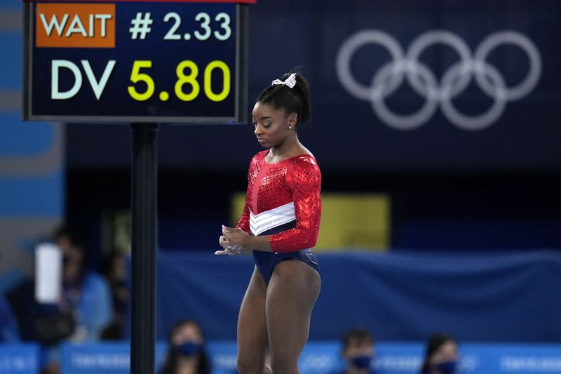 Simone Biles, of the United States, waits to perform on
the vault during the artistic gymnastics women’s final at the 2020
Summer Olympics, Tuesday, July 27, 2021, in Tokyo. The American
gymnastics superstar has withdrawn the all-around competition to
focus on her mental well-being.