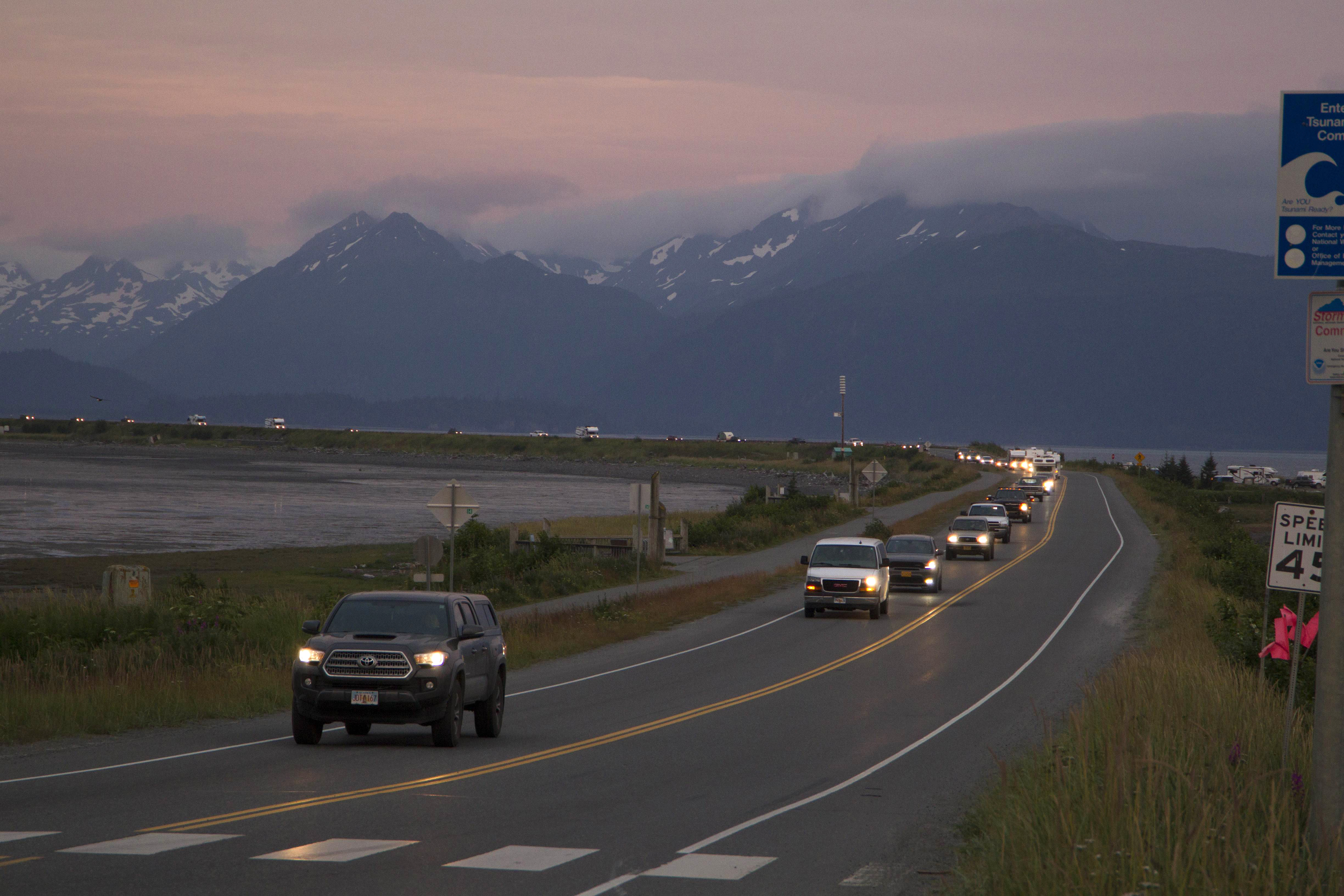 A line of cars evacuates the Homer Spit in Homer, Alaska Wednesday after a tsunami warning was issued following a magnitude 8.2 earthquake.