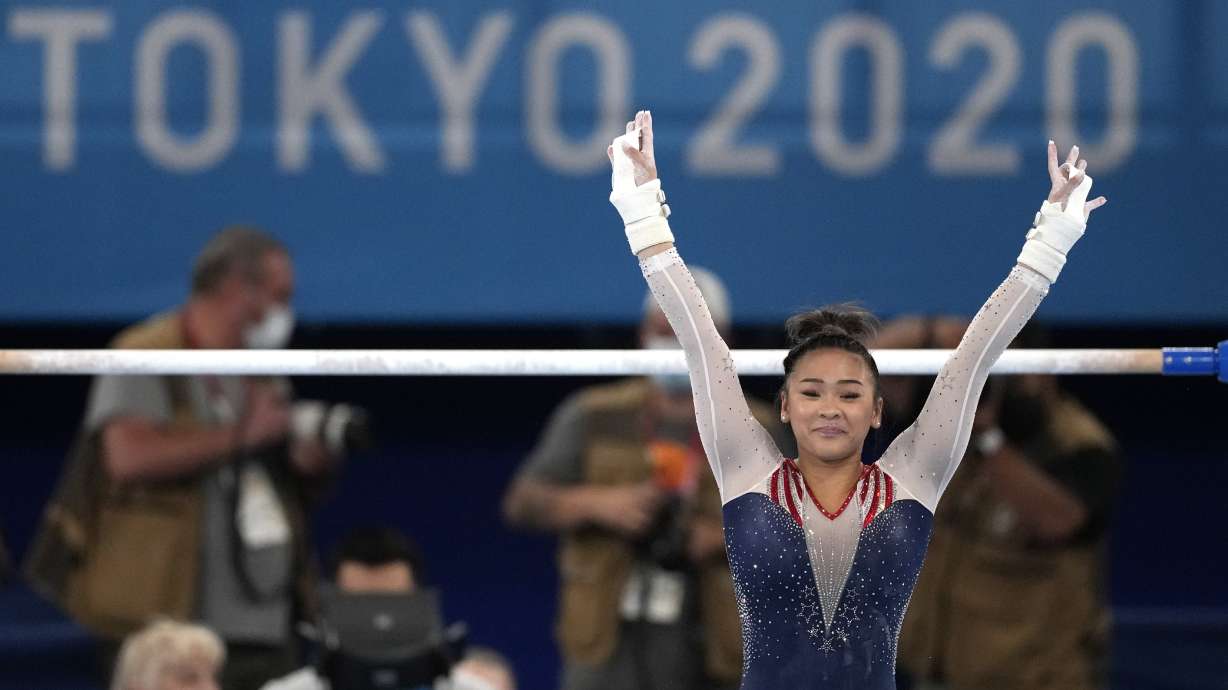 Sunisa Lee, of the United States, finishes on the uneven bars during the artistic gymnastics women's all-around final at the 2020 Summer Olympics, Thursday in Tokyo.