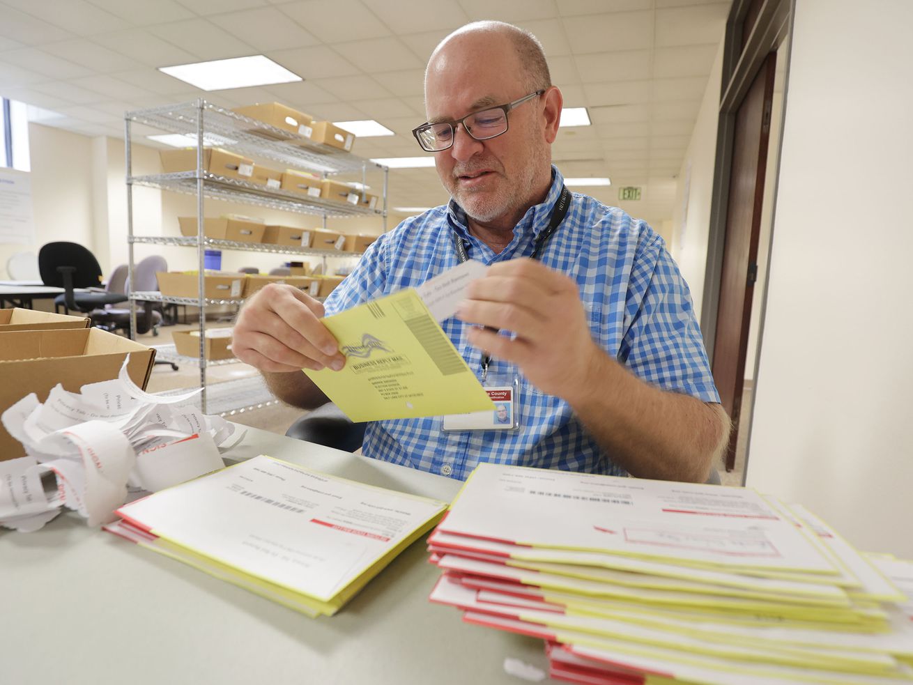 Salt Lake County Election Coordinator Michael Fife tabs returned ballots at the Salt Lake County Government Center in Salt
Lake City Wednesday. Utah election officials say mail-in ballots have more advantages than just preventing the spread of COVID-19.