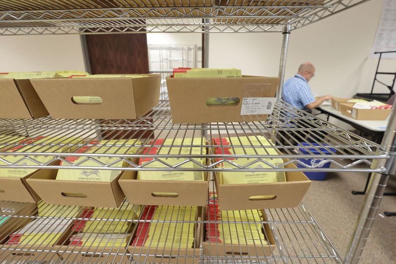Salt Lake County Election Coordinator Michael Fife tabs
returned ballots at the Salt Lake County Government Center in Salt
Lake City on Wednesday. Utah election officials say mail-in ballots have more advantages than just preventing the spread of COVID-19.