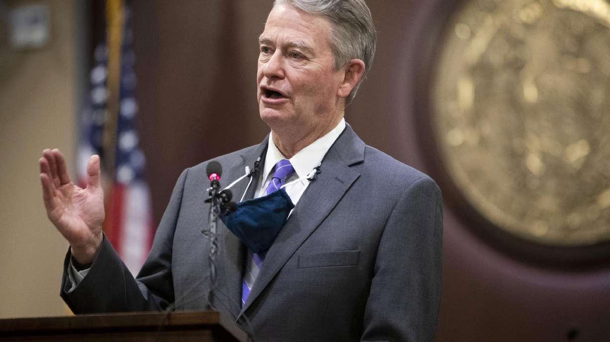 Idaho Gov. Brad Little gestures during a press conference at the Statehouse in Boise. Lawmakers on a House panel on Monday approved legislation to boost reading skills among young students, a priority for Gov. Brad Little.