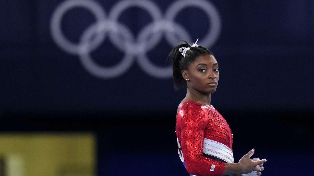Simone Biles waits to perform on the vault during the artistic gymnastics women's final at the 2020 Summer Olympics on Tuesday in Tokyo. A Salt Lake doctor at the Huntsman Mental Health Institute says society should understand that minds can sometimes get injured just like bodies can.
