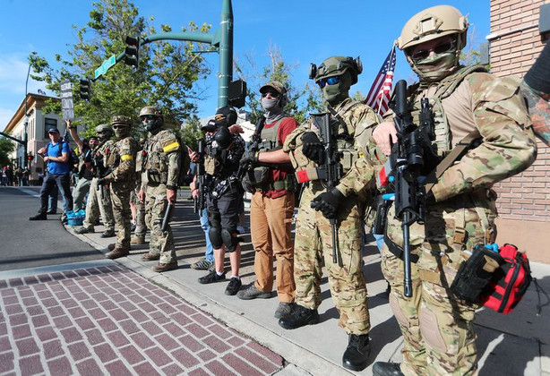 Counterprotesters organized by Utah Citizens Alarm
stand and watch as another group of protesters gather across the
street in Provo on Wednesday, July 1, 2020.
