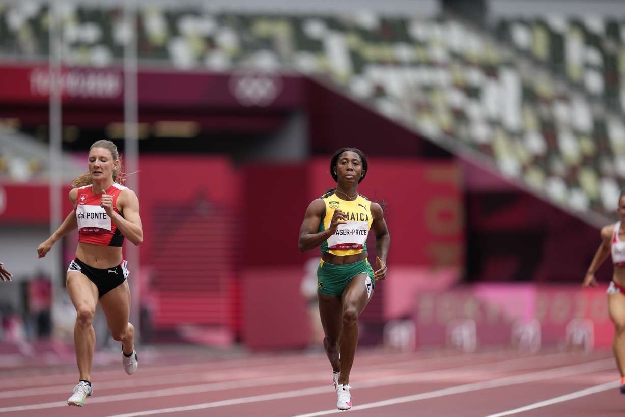 Shelly-Ann Fraser-Pryce, of Jamaica, wins a heat in the women's 100-meter run at the 2020 Summer Olympics, Friday, July 30, 2021, in Tokyo.