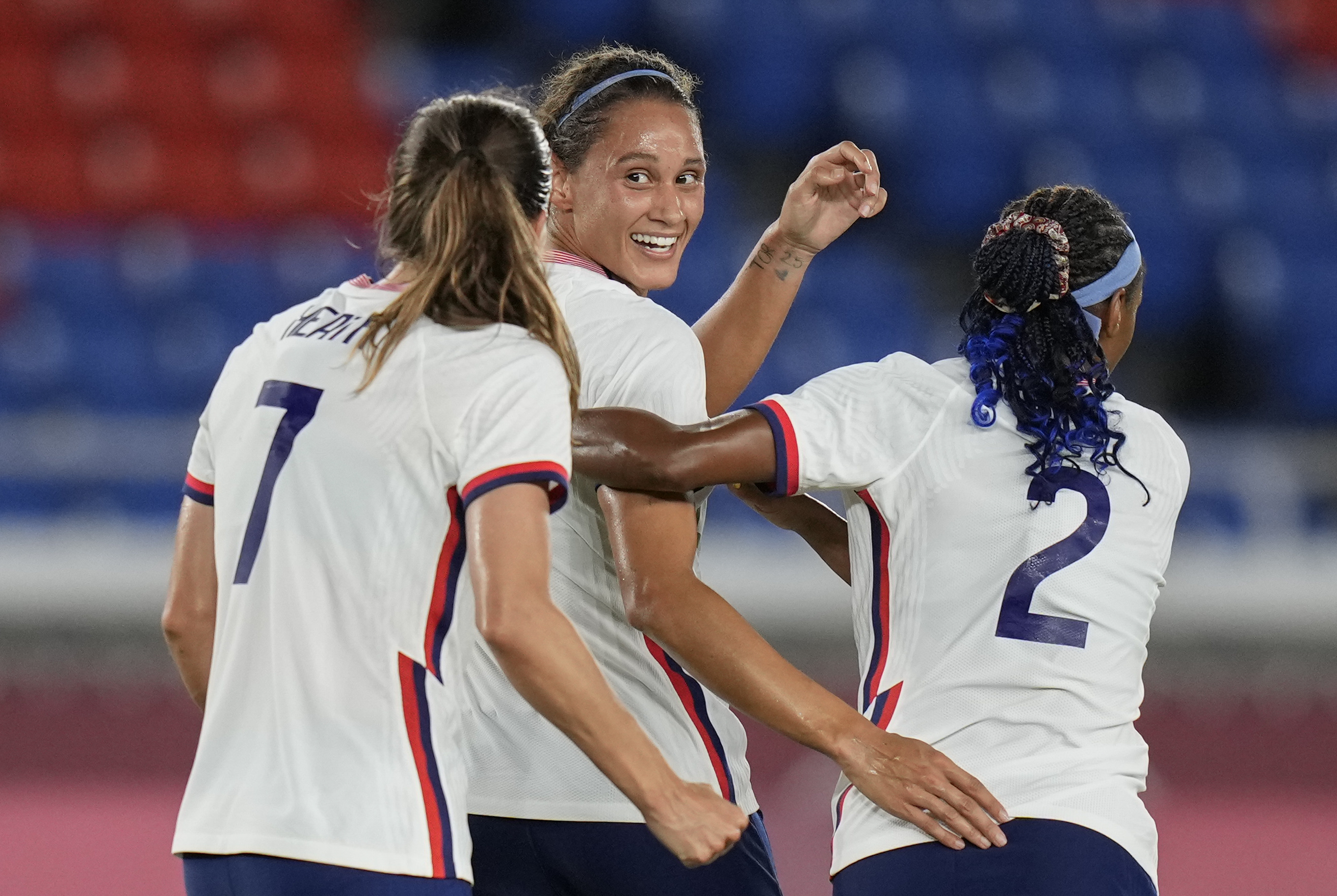 United States' Lynn Williams, center, celebrates with teammates after scoring a goal against Netherlands during a women's quarterfinal soccer match at the 2020 Summer Olympics, Friday, July 30, 2021, in Yokohama, Japan. 