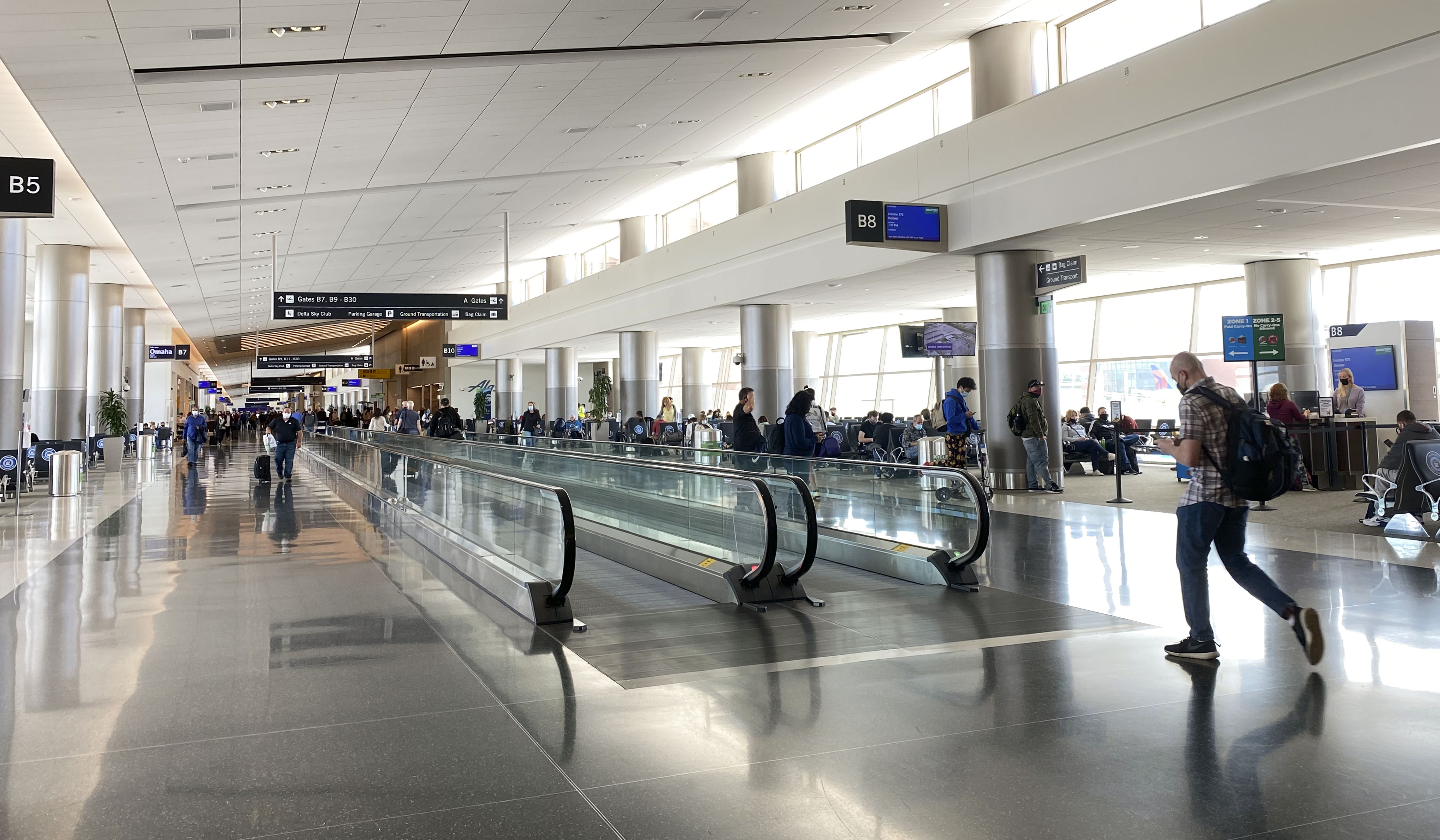 Travelers walk through the Salt Lake City International Airport on May 3. On Thursday, police arrested a Chicago man who they say was too drunk to board an airplane and refused to leave.