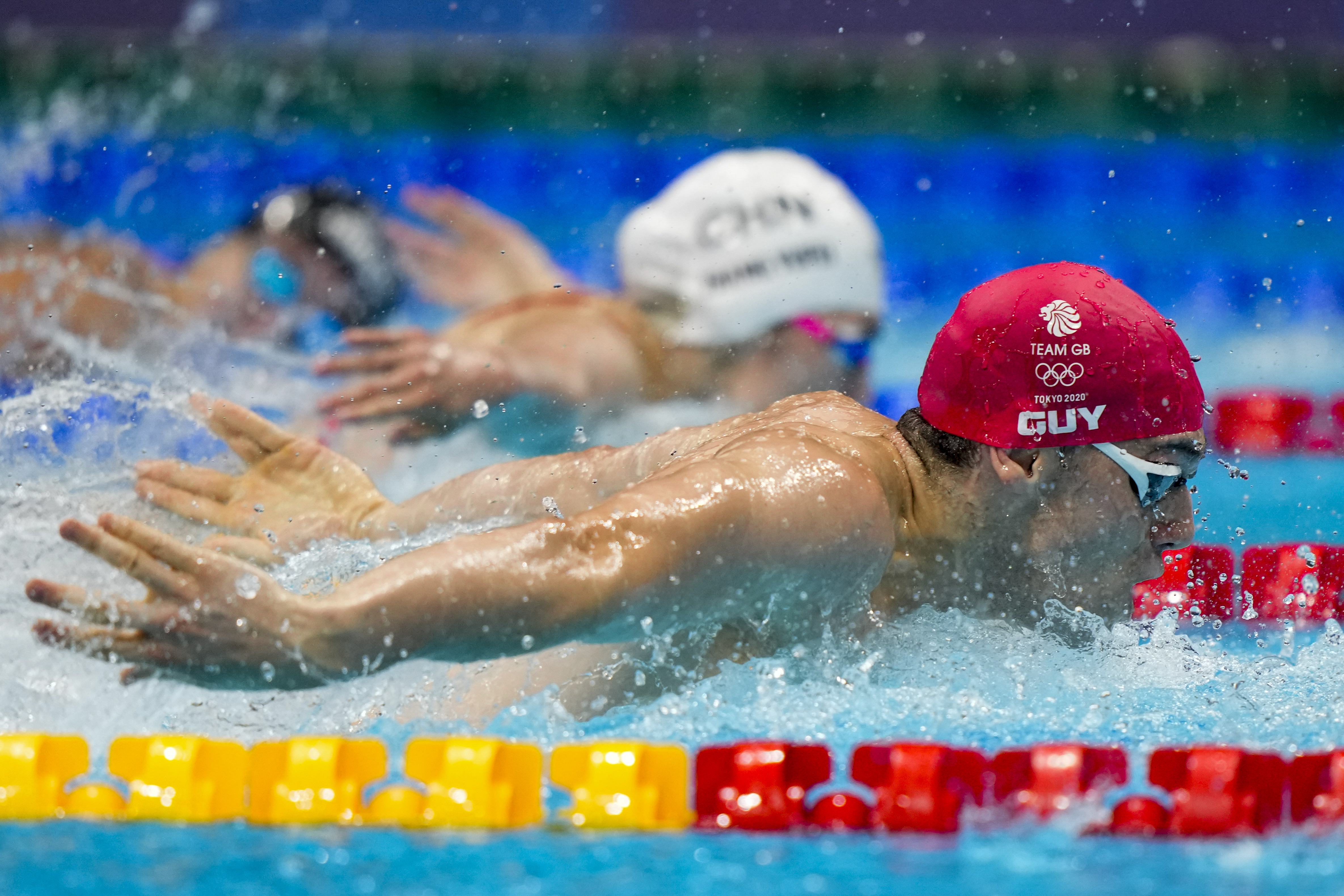 James Guy, of Britain, swims in a mixed 4x100-meter medley relay at the 2020 Summer Olympics, Saturday, July 31, 2021, in Tokyo, Japan. Britain won the gold medal.
