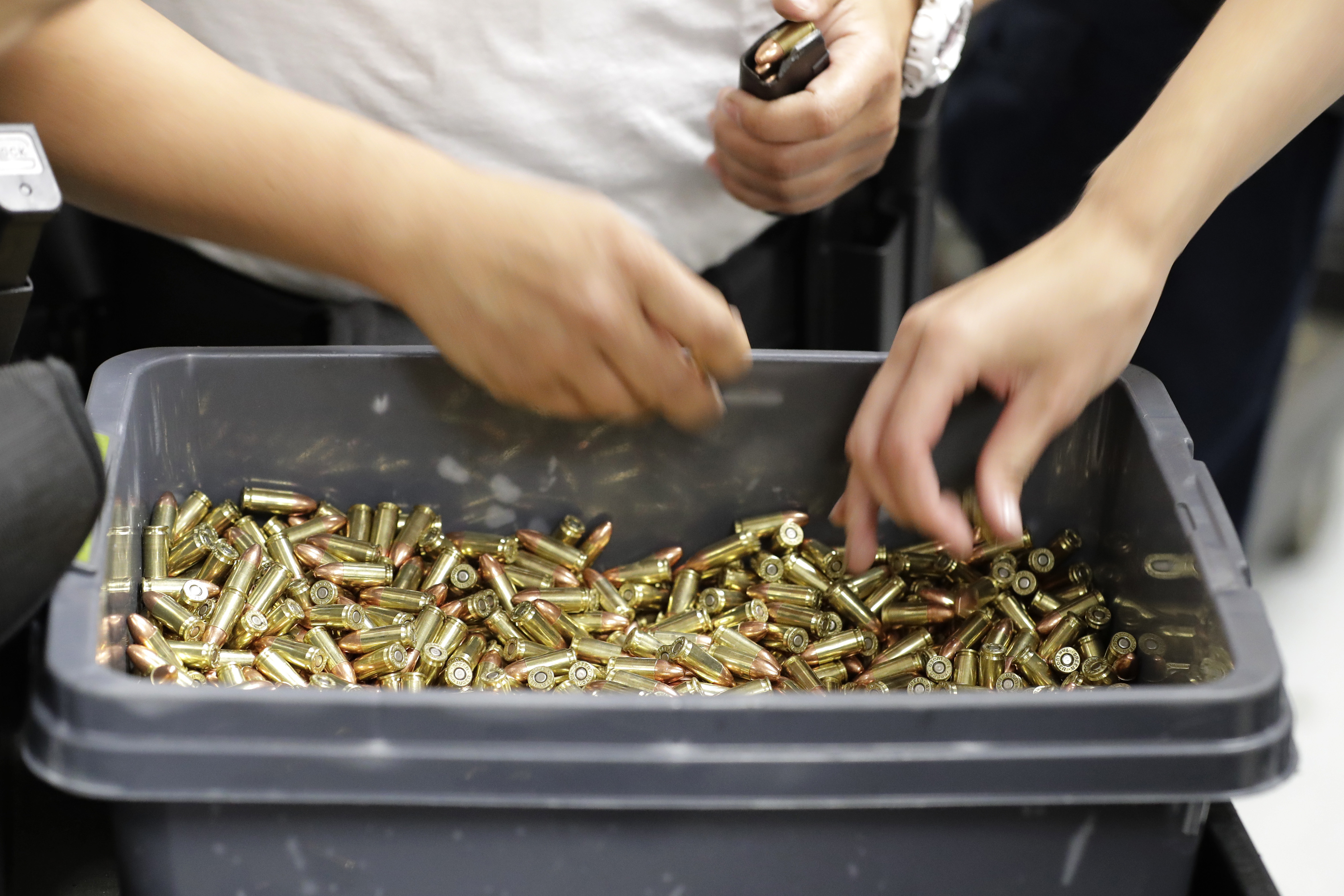 In this July 16, 2019 photo, officers load gun clips with ammunition at the Washington State Criminal Justice Training Commission in Burien, Wash. The pandemic coupled with record firearm sales have created a shortage of ammunition in the U.S.