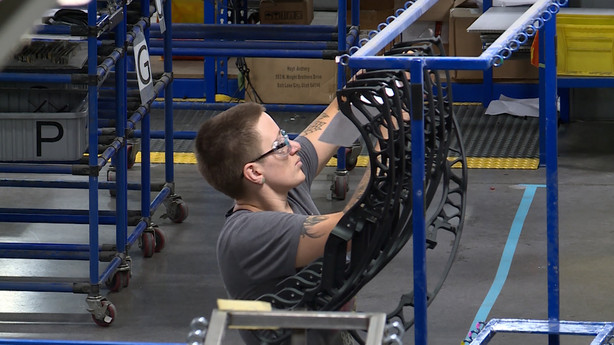 An individual works at Salt Lake City-based Hoyt. It supplies bows for nearly half of all Olympic archers.