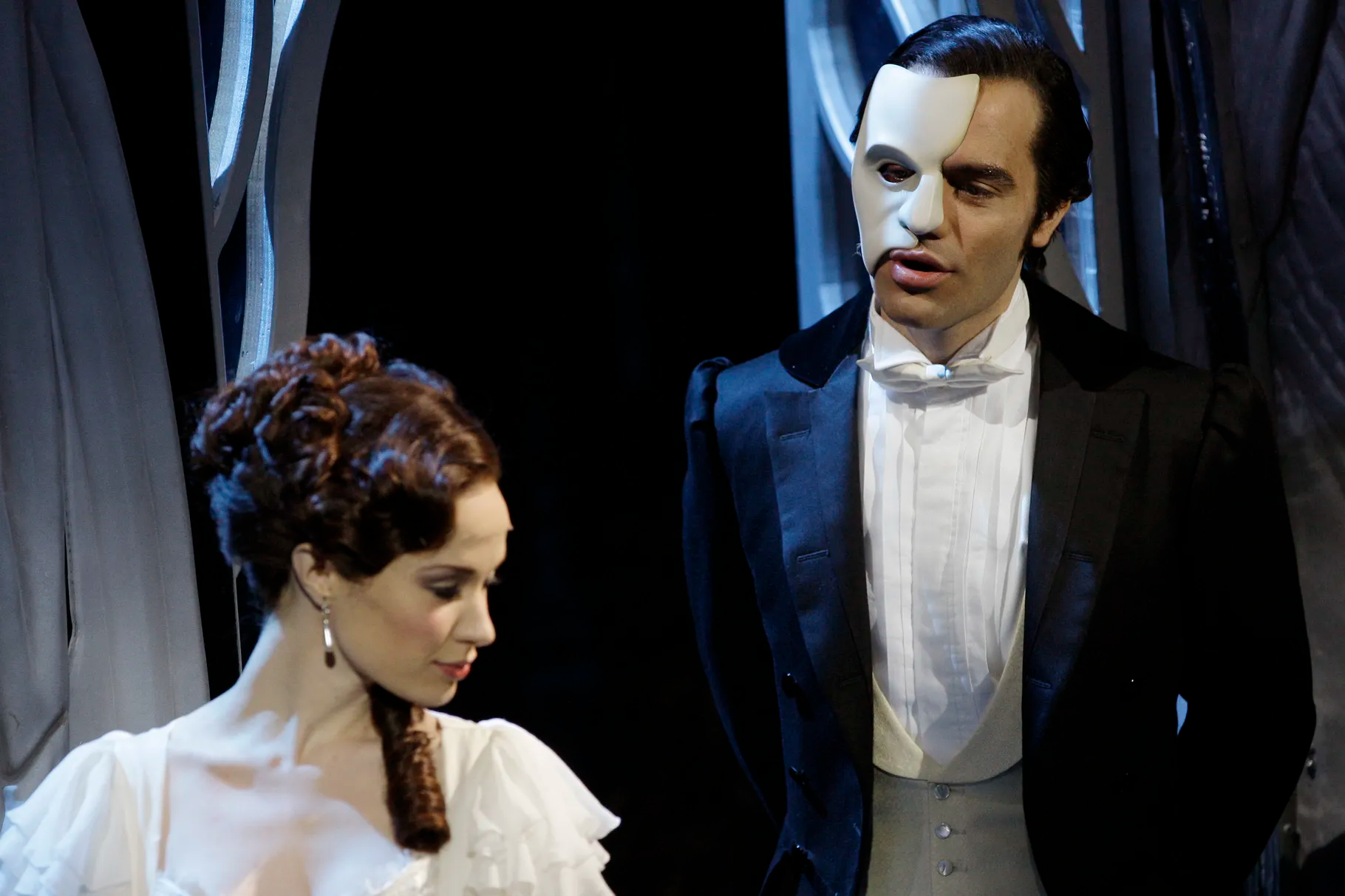 Ramin Karimloo, right, performs a scene with Sierra Boggess from the sequel to “The Phantom of the Opera,” “Love Never Dies” in central London, March 3, 2010. As shows begin to open in New York City, Broadway will require that everyone in their theaters be vaccinated against the coronavirus.