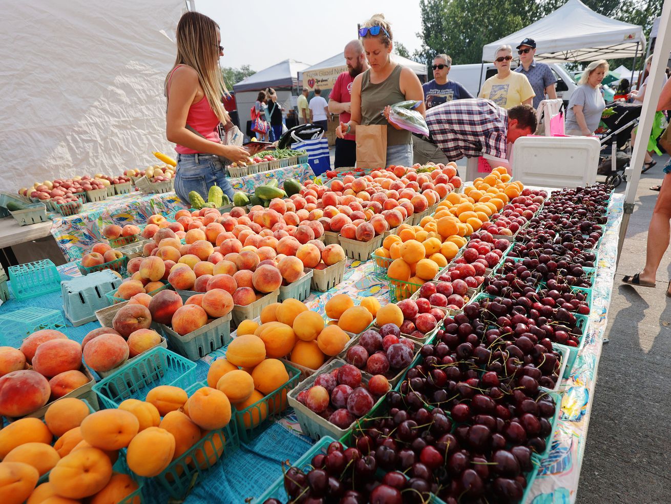 Chad’s Produce sells fruit at the Wheeler Historic Farm farmers market in Murray on Sunday, July 25.