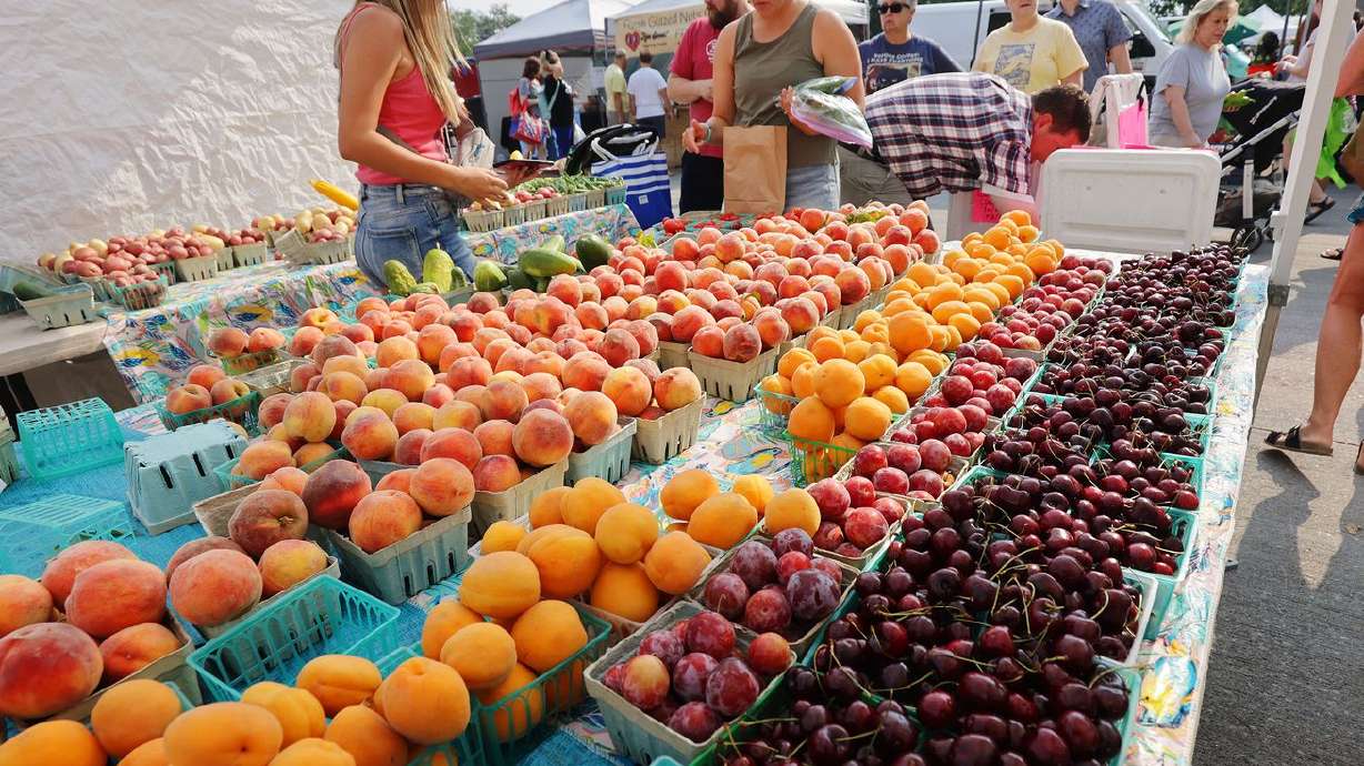 Chad’s Produce sells fruit at the Wheeler Historic Farm farmers market in Murray on Sunday, July 25.